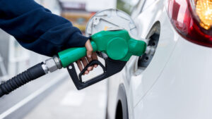 Photo of a gas pump in a car's gas tank.